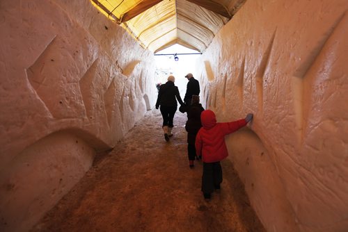 JOHN WOODS / WINNIPEG FREE PRESS Families make their way through a tunnel as they enter the last day of the Festival du Voyageur Sunday , February 21, 2016.