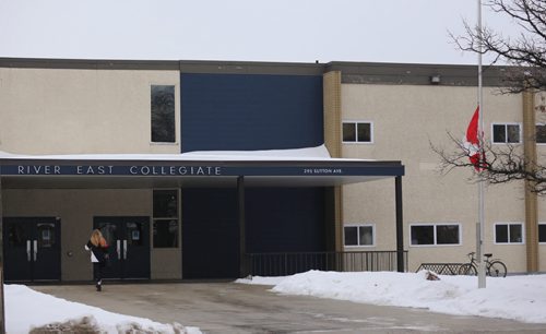 TREVOR HAGAN / WINNIPEG FREE PRESS The flag flies at half mast at River East Collegiate after the body of Cooper Nemeth was found late Saturday night. Monday, February 22, 2016.