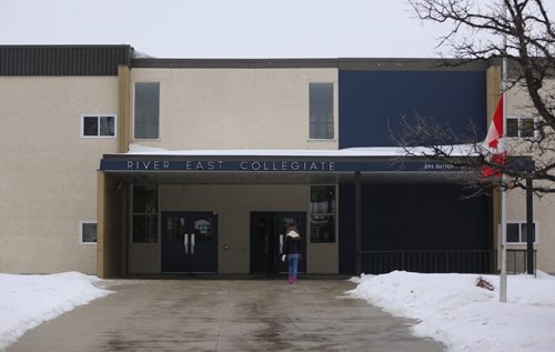TREVOR HAGAN / WINNIPEG FREE PRESS The flag flies at half mast at River East Collegiate after the body of Cooper Nemeth was found late Saturday night. Monday, February 22, 2016.