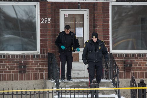 MIKE DEAL / WINNIPEG FREE PRESS Winnipeg Police Service investigate at a house on Pritchard Avenue where a body was removed from the home shortly after 2 p.m. 160222 - Monday, February 22, 2016