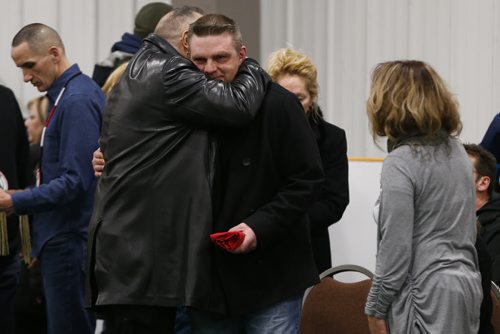 JOHN WOODS / WINNIPEG FREE PRESS Brent Nemeth, father of Cooper Nemeth, is comforted by friends and family at a smudging memorial service for Cooper Nemeth and his family at Gateway Recreation Centre Monday, February 22, 2016. Cooper Nemeth was found murdered on Saturday.