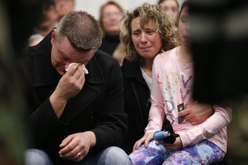 JOHN WOODS / WINNIPEG FREE PRESS Brent (from left), Kiana and Gaylene Nemeth, the family of Cooper Nemeth, weep and support each other at a smudging memorial service for Cooper and his family at Gateway Recreation Centre Monday, February 22, 2016. Cooper Nemeth was found murdered on Saturday.