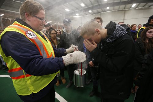 JOHN WOODS / WINNIPEG FREE PRESS Friends and family take part in a smudging ceremony facilitated by the Bear Clan at a memorial service for Cooper Nemeth and his family at Gateway Recreation Centre Monday, February 22, 2016. Cooper Nemeth was found murdered on Saturday.
