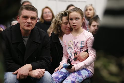JOHN WOODS / WINNIPEG FREE PRESS  Brent(from left), Gaylene and Kiana Nemeth, the family of Cooper Nemeth, listen to drummers at a smudging memorial service for Cooper and his family at Gateway Recreation Centre Monday, February 22, 2016. Cooper Nemeth was found murdered on Saturday.