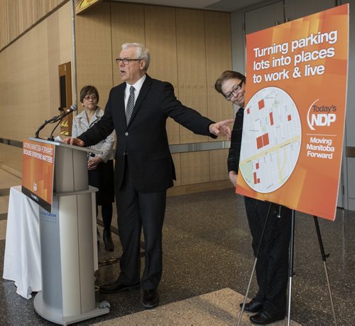 DAVID LIPNOWSKI / WINNIPEG FREE PRESS   NDP Manitoba Party Leader and Premier of Manitoba Greg Selinger makes a surface parking lot announcement flanked by  MLA's Flor Marcelino (left) and Melanie Wight (right) in the lobby of the RBC Convention Centre lobby Tuesday February 23, 2016.