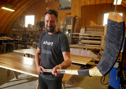 BORIS MINKEVICH / WINNIPEG FREE PRESS Wood Anchor design firm's Jason Neufeld in his company with a hockey stick. Wood Anchor is located on Waverley St, just south of the Trans-Canada Highway. Wood Anchor is creating sculptures out of used wooden hockey sticks for the Forks Market renovations and is accepting donations from the public. They need around 30 or 40 sticks. They also make new tables/chairs. The company uses reclaimed materials. Alex De Pape story. Photo taken February 23, 2016