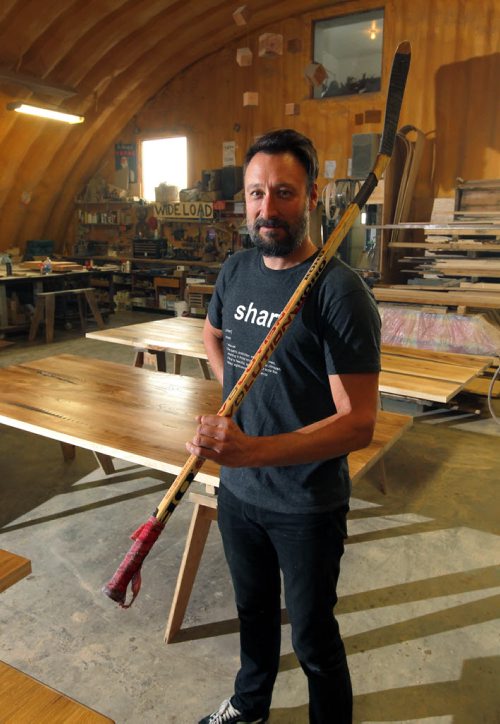 BORIS MINKEVICH / WINNIPEG FREE PRESS Wood Anchor design firm's Jason Neufeld in his company with a hockey stick. Wood Anchor is located on Waverley St, just south of the Trans-Canada Highway. Wood Anchor is creating sculptures out of used wooden hockey sticks for the Forks Market renovations and is accepting donations from the public. They need around 30 or 40 sticks. They also make new tables/chairs. The company uses reclaimed materials. Alex De Pape story. Photo taken February 23, 2016