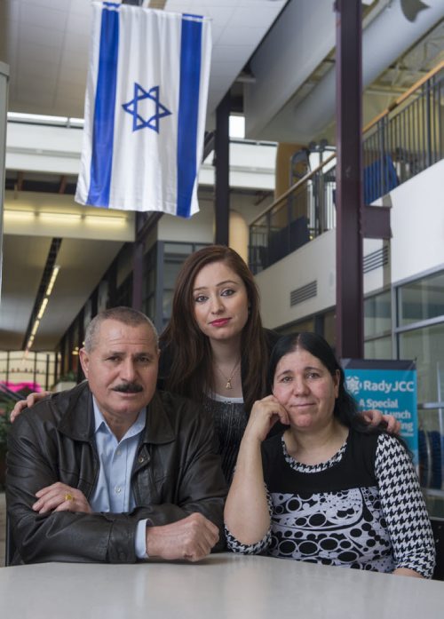 DAVID LIPNOWSKI / WINNIPEG FREE PRESS   Nafiya Naso (centre) with mom Koulan Fandi and dad Enez Jallo at the Rady Jewish Community Centre Wednesday February 24, 2016. The Yazidi refugees who live on Doncaster across the street from the Rady Centre were afraid to go there because they were raised to be scared of Jews. Now the couple go almost every day to swim and walk laps and the Jewish community is helping to sponsor Yazidi refugees from Iraq and Syria to come to Canada.