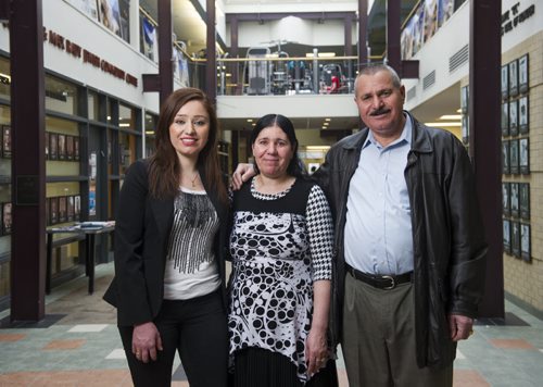 DAVID LIPNOWSKI / WINNIPEG FREE PRESS   Nafiya Naso (left) with mom Koulan Fandi and dad Enez Jallo at the Rady Jewish Community Centre Wednesday February 24, 2016.  The Yazidi refugees who live on Doncaster across the street from the Rady Centre were afraid to go there because they were raised to be scared of Jews. Now the couple go almost every day to swim and walk laps and the Jewish community is helping to sponsor Yazidi refugees from Iraq and Syria to come to Canada.