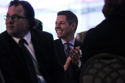MIKE DEAL / WINNIPEG FREE PRESS Winnipeg Mayor Brian Bowman claps at the head table during the annual Chamber of Commerce luncheon at the RBC Convention Centre where he will give his State of the City address.  160225 February 25, 2016