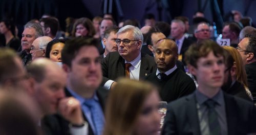 MIKE DEAL / WINNIPEG FREE PRESS University of Manitoba's President and Vice-Chancellor, Dr. David Barnard (centre) listens to Winnipeg Mayor Brian Bowman's State of the City address during the annual Winnipeg Chamber of Commerce luncheon at the RBC Convention Centre Thursday. 160225 - Thursday, February 25, 2016