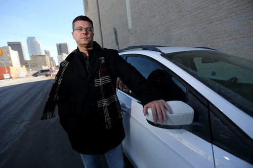 TREVOR HAGAN / WINNIPEG FREE PRESS Dean Mullin poses next to his car that was recently wrongfully ticket and towed along with several other vehicles, Thursday, February 25, 2016.  For Gord Sinclair