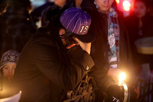 TREVOR HAGAN / WINNIPEG FREE PRESS John Munroe at a vigil in memory of his mother, Marilyn Rose Munroe, who was found dead inside her home on Pritchard Avenue earlier this week, Thursday, February 25, 2016.