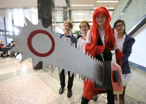 JASON HALSTEAD / WINNIPEG FREE PRESS  McKinley Macchia, 12, (front), dressed as Grell Sutcliff from 'Black Butler', with friends (from left) Roxanne Stoik, 12, Addison Miller, 12, and Bryanna Su, 12, at the fifth annual Ai-Kon Winter Festival at the RBC Convention Centre on Feb. 27, 2016. The event, which focuses on anime, featured exhibitors and vendors, artist's alley, as well as a gamers' lounge, Mario Kart 8 and Super Smash Bros 4 tournaments and dance.