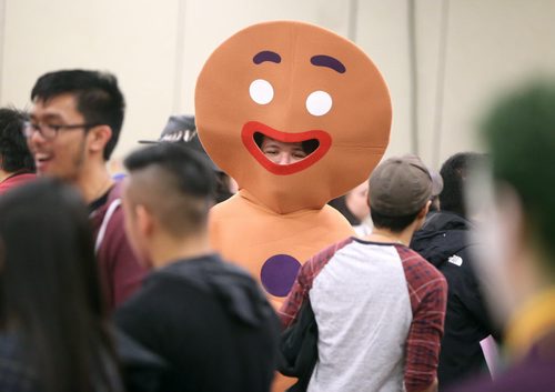 JASON HALSTEAD / WINNIPEG FREE PRESS  Sean Friesen, 20, dressed as Gingerbread Man from 'Shrek,' checks out vendor stalls at the fifth annual Ai-Kon Winter Festival at the RBC Convention Centre on Feb. 27, 2016. The event, which focuses on anime, featured exhibitors and vendors, artist's alley, as well as a gamers' lounge, Mario Kart 8 and Super Smash Bros 4 tournaments and dance.