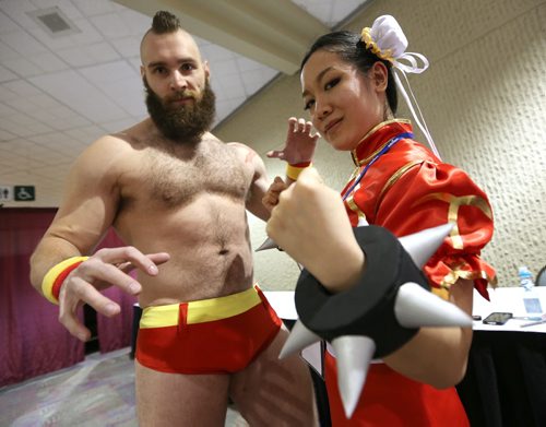 JASON HALSTEAD / WINNIPEG FREE PRESS  May-Fong Yee, dressed as Chun-Li from Street Fighter (right), and Nick Enns, dressed as Zangief from Street Fighter, strike a pose at the fifth annual Ai-Kon Winter Festival at the RBC Convention Centre on Feb. 27, 2016. The event, which focuses on anime, featured exhibitors and vendors, artist's alley, as well as a gamers' lounge, Mario Kart 8 and Super Smash Bros 4 tournaments and dance.