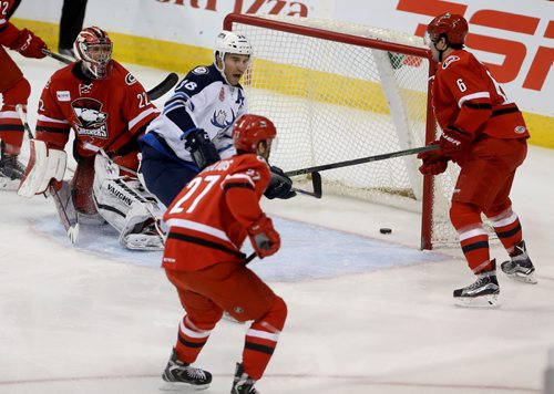 TREVOR HAGAN / WINNIPEG FREE PRESS Manitoba Moose Patrice Cormier (28) scores on Charlotte Checkers' goaltender Drew MacIntyre (22) as Ryan Murphy (6) and Jake Chelios (27) look on during first period AHL hockey action at MTS Centre, Saturday, February 27, 2016.