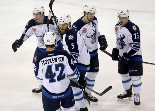 TREVOR HAGAN / WINNIPEG FREE PRESS The Manitoba Moose celebrate after Thomas Raffl (5), scored against the Charlotte Checkers during first period AHL hockey action at MTS Centre, Saturday, February 27, 2016.