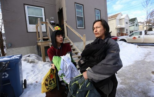 TREVOR HAGAN / WINNIPEG FREE PRESS Cyril Bruce, right, with his son Nathaniel, residents of a rooming house on the 300 block of Alexander Avenue where an early morning fire killed two people, Sunday, February 28, 2016.