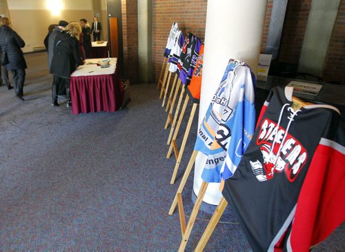 BORIS MINKEVICH / WINNIPEG FREE PRESS Cooper Nemeth funeral at the Calvary Temple in Winnipeg, MB.  people sign the guest book past a display of hockey jerseys from MB teams. Photo taken February 29, 2016