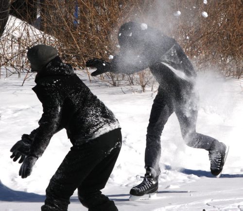 JOE BRYKSA / WINNIPEG FREE PRESS   Caleb Beynon gets nailed by a snowball during a friendly  snowball fight with friends at Assiniboine Park Tuesday, March 01, 2016.( Standup Photo) ( 1 of 2 photos)