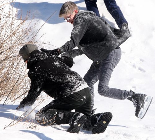 JOE BRYKSA / WINNIPEG FREE PRESS    Caleb Beynon gets nailed by a snowball during a friendly  snowball fight with friends at Assiniboine Park Tuesday, March 01, 2016.( Standup Photo) ( 2 of 2 photos)