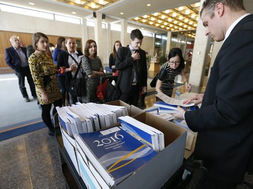 WAYNE GLOWACKI / WINNIPEG FREE PRESS  
  Reporters line up to receive their copy of the 2016 City of Winnipeg Preliminary Budget Wednesday as they head into a committee room at City Hall. Aldo Santin story March 2 2016