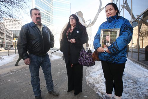 JOE BRYKSA / WINNIPEG FREE PRESSFather  Daniel Joubert, mother Christine and sister Rejeanne  who holds photo of her deceased brother Robert Joubert outside Manitoba Law Courts where they were at the sentencing of Martin Jolicoeur who pleaded guilty to impaired driving that killed their son/brother Robert Joubert, 22 yrs, in a crash in June 2012 , March 02, 2016.(See Mike McIntyre story)