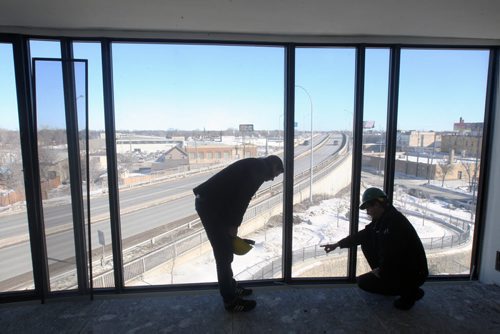 JOE BRYKSA / WINNIPEG FREE PRESS  MARK PENNER, president of Green Seed Development Corp. with JP Boge- Construction Manager at theircondo project called 62M at the corner of Waterfront Drive and McDonald Avenue., March 03, 2016.(See Murray McNeil Story)