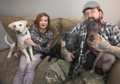 JOE BRYKSA / WINNIPEG FREE PRESS  Eric Johanson and his wife Rachel with their dogs L to R,  Lulu who was rescued from North Of Norway House, Tito who was rescued from  the former Yugoslavia and Kuxuum who was rescued from Mexico , March 04, 2016.(See  Gordon Sinclair column)