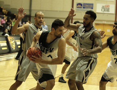 RUTH BONNEVILLE / WINNIPEG FREE PRESS Fraser Valley Cascades Navjot Bains tries to keep control of the ball while playing against the Manitoba Bisons  during the second half of the game in the Canada West quarter-final Basketball series at the Investors Group Athletic Centre Friday evening.    March 3rd, 2016