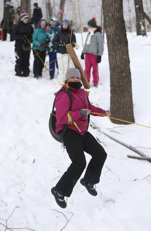 JASON HALSTEAD / WINNIPEG FREE PRESS  Samara Schenkeveld, 13, of the 212th Pathfinders crosses a shallow ravine on a zip-line as more than 300 Scouts tested their survival skills in Scouts Canadas annual Klondike Derby on March 5, 2016, at Camp Amisk south of Winnipeg. Teams of six to eight Cub Scouts, Scouts, Girl Guides and Pathfinders pulled a Klondike-style sleigh over a 2.5-kilometre course through the woods, competing at tasks including fire lighting, a flood disaster scenario and a simulated ice rescue.