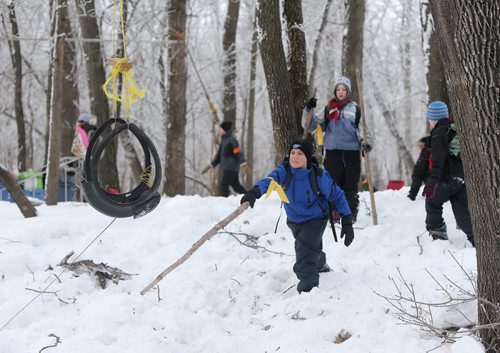 JASON HALSTEAD / WINNIPEG FREE PRESS  Damon Barteaux, 11, of the 49th Winnipeg Scout troop tries to retrieve his team's zip-line chair as more than 300 Scouts tested their survival skills in Scouts Canadas annual Klondike Derby on March 5, 2016, at Camp Amisk south of Winnipeg. Teams of six to eight Cub Scouts, Scouts, Girl Guides and Pathfinders pulled a Klondike-style sleigh over a 2.5-kilometre course through the woods, competing at tasks including fire lighting, a flood disaster scenario and a simulated ice rescue.