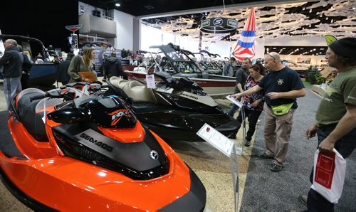 JASON HALSTEAD / WINNIPEG FREE PRESS  Visitors check out personal water craft at the Enns Brothers display at the Mid-Canada Boat Show at the RBC Convention Centre Winnipeg on March 5, 2016. (See Rollason story)