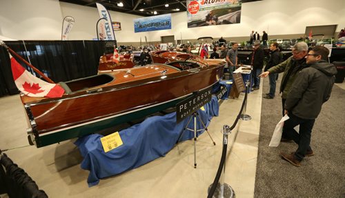 JASON HALSTEAD / WINNIPEG FREE PRESS  Visitors check out vintage restored boats at the Peterson Boat Works display at the Mid-Canada Boat Show at the RBC Convention Centre Winnipeg on March 5, 2016. (See Rollason story)