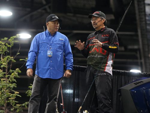 JASON HALSTEAD / WINNIPEG FREE PRESS  Pro anglers Bob Izumi (left) and Ted Takasaki talk to the crowd at the Lund Theatre at the Mid-Canada Boat Show at the RBC Convention Centre Winnipeg on March 5, 2016. (See Rollason story)
