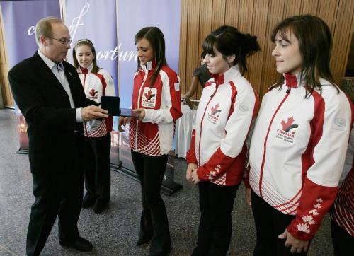 John Woods / Winnipeg Free Press / February 25, 2008 - 080225 - Mayor Sam Katz presented a medal to the junior curling team of Kaitlyn Lawes at city hall Tuesday February 26, 2008.  The team (L to R) is made up of Kaitlyn Lawes, Jenna Loder (receiving her medal), Liz Peters, Sarah Wazney, and MJ McKenzie (out of frame).