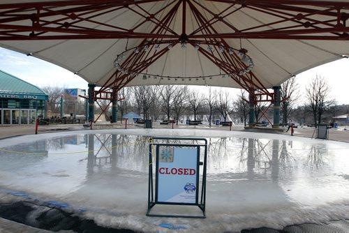 BORIS MINKEVICH / WINNIPEG FREE PRESS Skating at the Forks or the river trail is all but a memory as warm weather forced the trail to be closed. Workers have been removing all the benches and warm up huts. Here the rink under the canopy is melted. Photo taken March 07, 2016