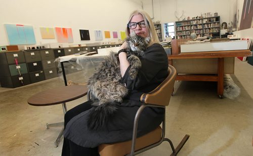 PHIL HOSSACK / WINNIPEG FREE PRESS Posing in her studio, Winnipeg artist Wanda Koop nuzzles her cat George. re: Gov. General's Award. See story. March 7, 2016