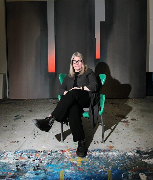 PHIL HOSSACK / WINNIPEG FREE PRESS Framed in one of her large canvasses, Winnipeg artist Wanda Koop poses in her studio Monday. re: Gov. General's Award. See story. March 7, 2016.