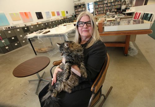 PHIL HOSSACK / WINNIPEG FREE PRESS Posing in her studio, Winnipeg artist Wanda Koop nuzzles her cat George. re: Gov. General's Award. See story. March 7, 2016