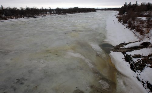 JOE BRYKSA / WINNIPEG FREE PRESS  A few residents who live in the area of the Red River near the St Vital bridge have noticed a yellow ice patches which they say they have never seen before- This view is off the St. Vital bridge looking south  March 08, 2016,(See story)