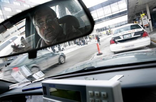 John Woods / Winnipeg Free Press / February 27, 2008 - 080227 - Gurmail Mangat, sitting in his taxi at the airport, speaks about the call for more cabs in Winnipeg by Gail Asper and the Winnipeg Taxi Board Wednesday February 27, 2008.  Mangat said it was not uncommon to sit waiting for a fare for 45 minutes at the airport.