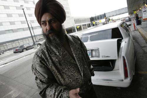 John Woods / Winnipeg Free Press / February 27, 2008 - 080227 - Gurmit Singh Brar, standing beside his limo at the airport, speaks about the call for more cabs in Winnipeg by Gail Asper and the Winnipeg Taxi Board Wednesday February 27, 2008.  When we left Brar he had been waiting for a fare for 1 hour 45 minutes.