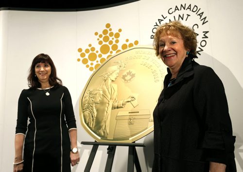 WAYNE GLOWACKI / WINNIPEG FREE PRESS  Lila Goodspeed, Chair, The Nellie McClung Foundation at right with Bonnie Staples-Lyon, Director, Royal Canadian Mint Board of Directors by the design of the new $1 circulation coin celebrating the 100th anniversary of a milestone in the history of womens right to vote in Canada. The event was held at the Canadian Museum for Human Rights Tuesday. Ashley Prest story March 8 2016