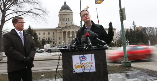 WAYNE GLOWACKI / WINNIPEG FREE PRESS At left, Tim Scott, vice president Marketing and Sales with CAA Manitoba and Chris Goertzen,pres.Association of Manitoba Municipalities in front of the Manitoba Legislative building to launch CAA's 5th Annual Worst Roads Campaign. Kevin Rollason story March 9 2016