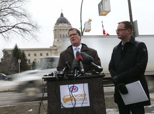 WAYNE GLOWACKI / WINNIPEG FREE PRESS At left, Tim Scott, vice president Marketing and Sales with CAA Manitoba and Chris Goertzen,pres.Association of Manitoba Municipalities in front of the Manitoba Legislative building to launch CAA's 5th Annual Worst Roads Campaign. Kevin Rollason story March 9 2016