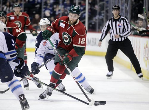 PHIL HOSSACK / WINNIPEG FREE PRESS Iowa Wild #12 Colton Beck works his way along the boards towards the Moose end at the MTS Center Wednesday. March 9, 2016