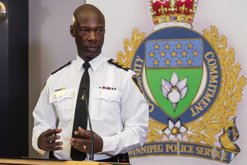 MIKE DEAL / WINNIPEG FREE PRESS Winnipeg Police Chief, Devon Clunis announces his retirement at the Public Safety Building while his wife Pearlene Clunis, Winnipeg Mayor Bowman and Police Board Chair Scott Gillingham look on, Thursday, March 10, 2016. 160310 - Thursday, March 10, 2016