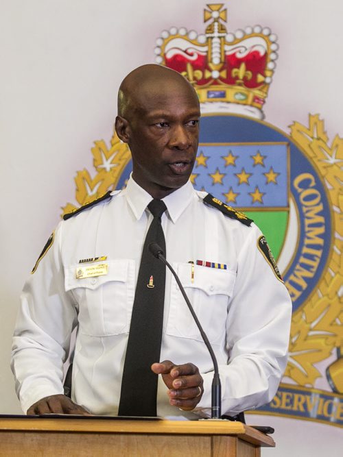 MIKE DEAL / WINNIPEG FREE PRESS Winnipeg Police Chief, Devon Clunis announces his retirement at the Public Safety Building while his wife Pearlene Clunis, Winnipeg Mayor Bowman and Police Board Chair Scott Gillingham look on, Thursday, March 10, 2016. 160310 - Thursday, March 10, 2016